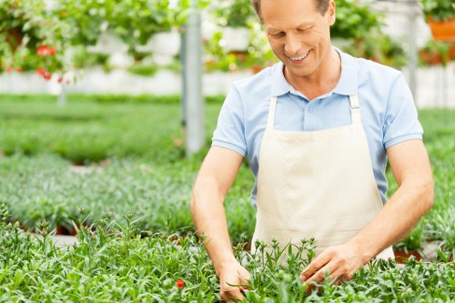 Composting bays and volunteers turning green waste
